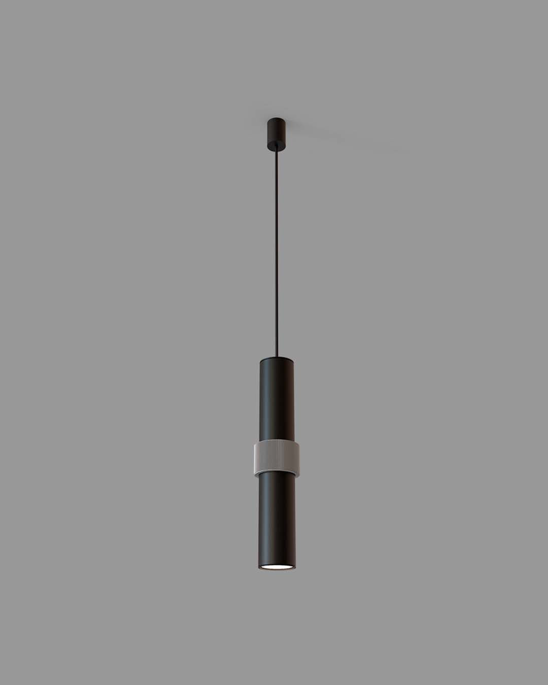 Lámpara colgante negra de diseño moderno, cilíndrica, para iluminación interior.