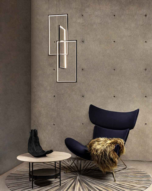 Lámparas colgantes modernas en ambiente minimalista con sillón y mesa auxiliar
