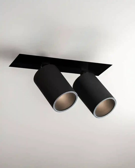 Lámpara de techo negra cilíndrica doble moderna en ambiente minimalista, Birot MX iluminación.