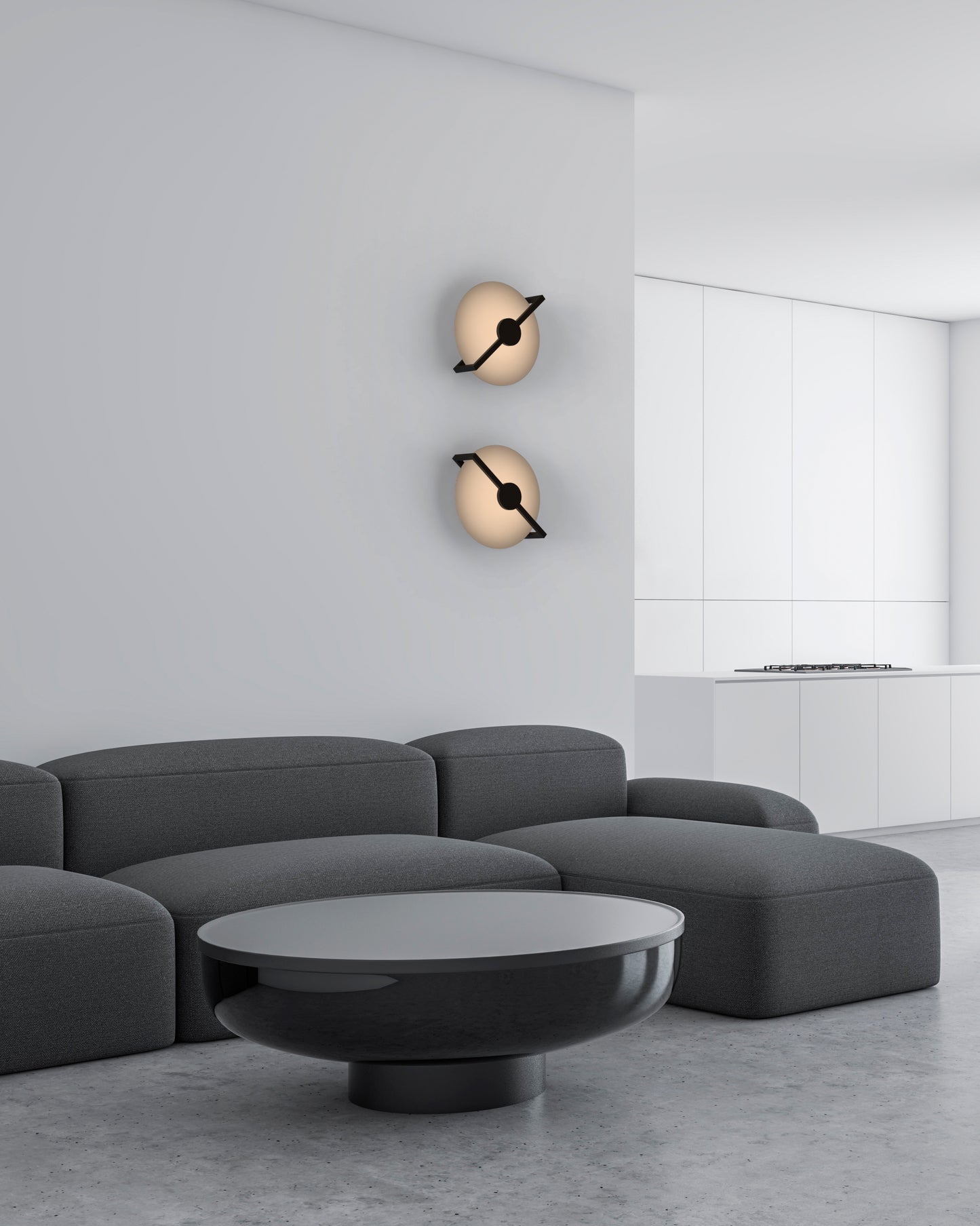 Sala minimalista con sofá gris, mesa baja negra y apliques de pared modernos iluminados.