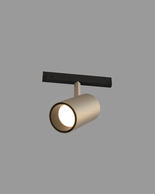 Spot de riel cilíndrico color plata para iluminación interior moderna