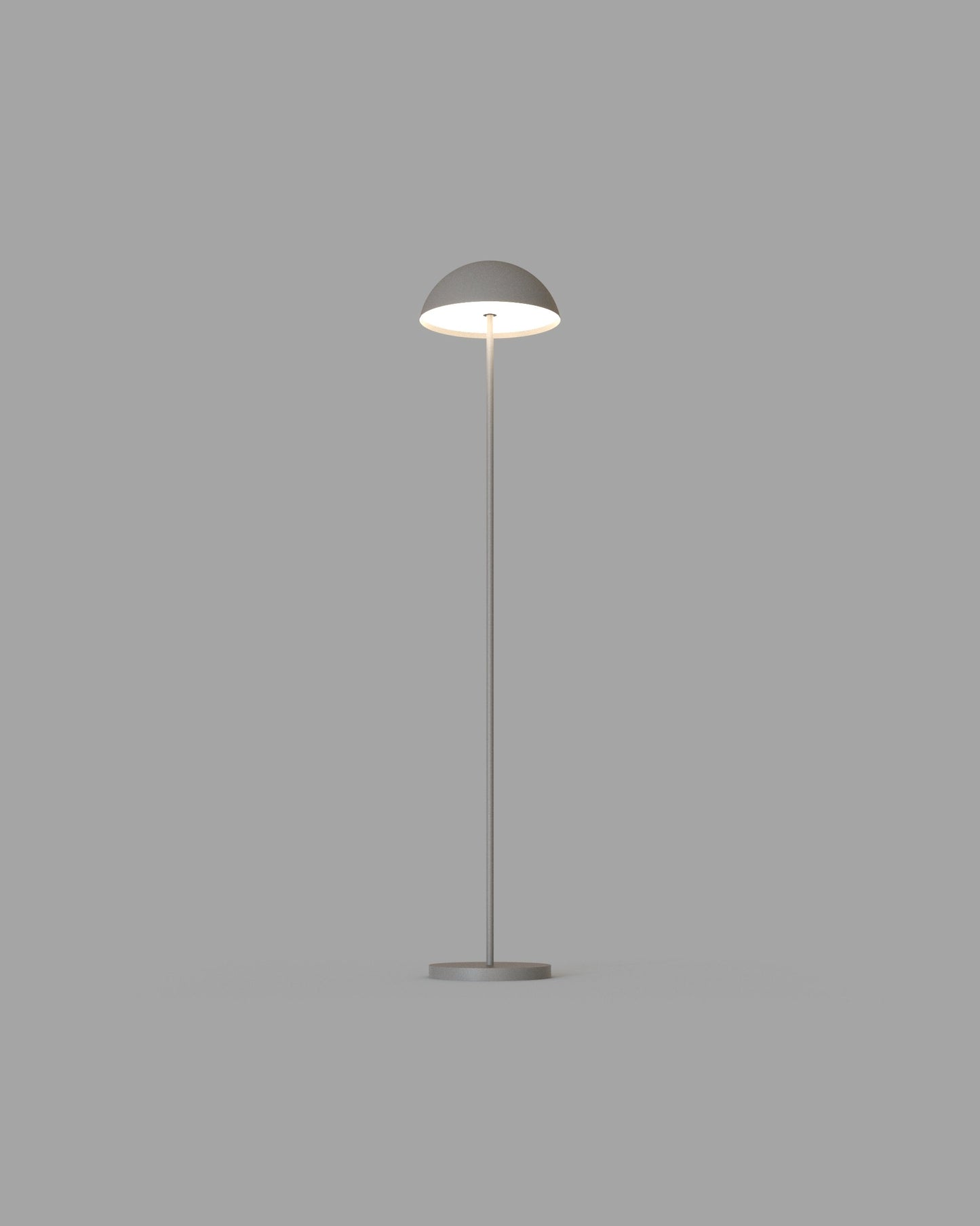 Lámpara de pie gris moderna con base redonda y pantalla semiesférica, encendida