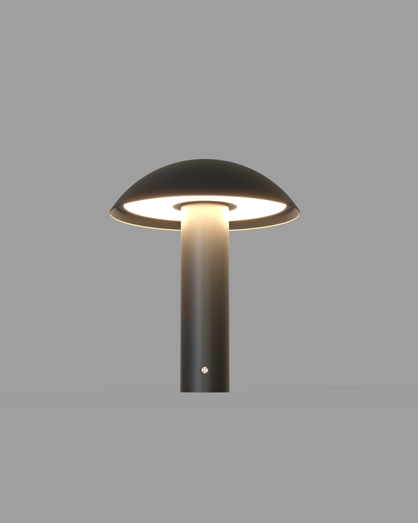 Lámpara de mesa negra con diseño moderno y luz LED, fondo gris minimalista.