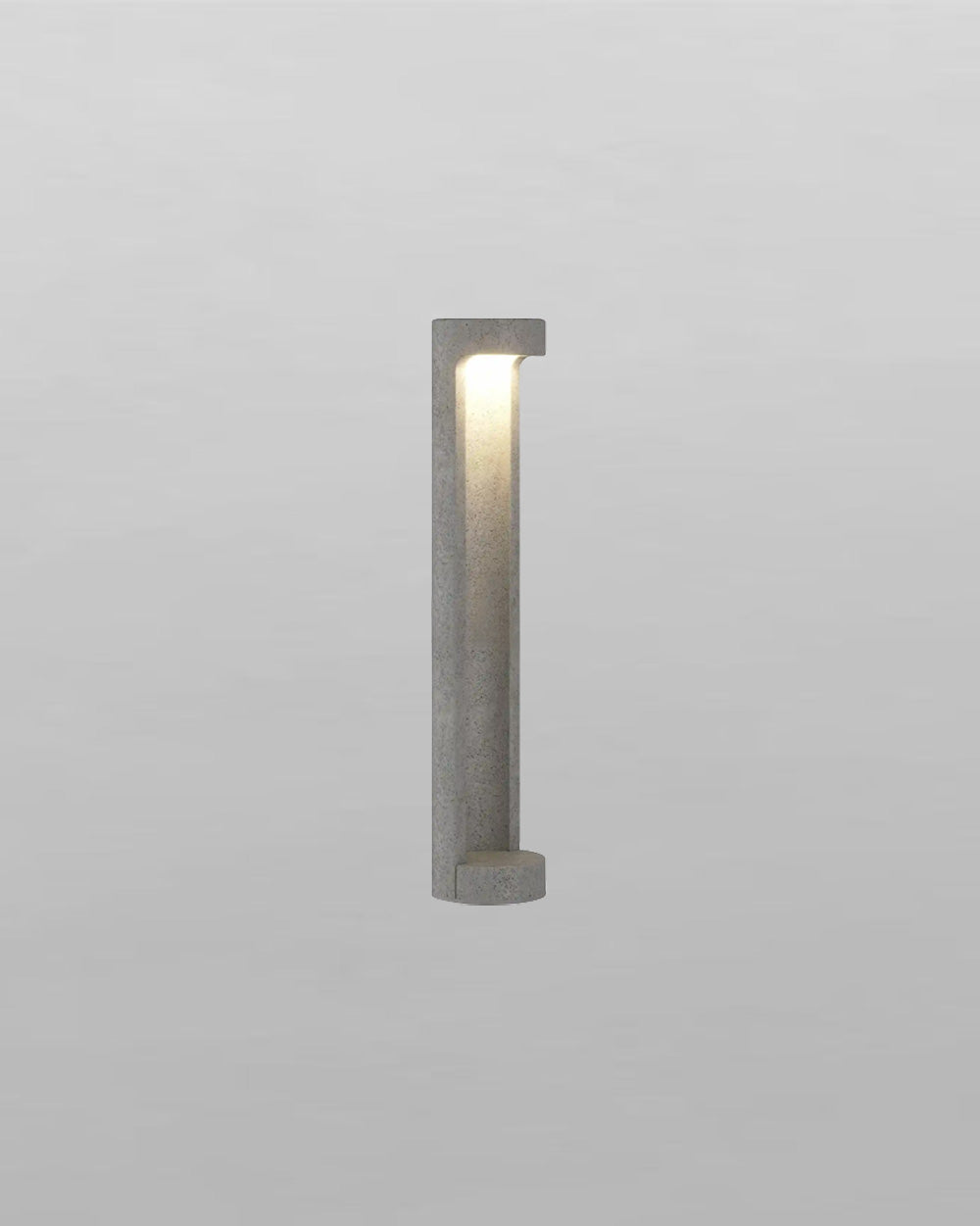 aplique de pared moderno de concreto gris con luz LED encendida, diseño minimalista
