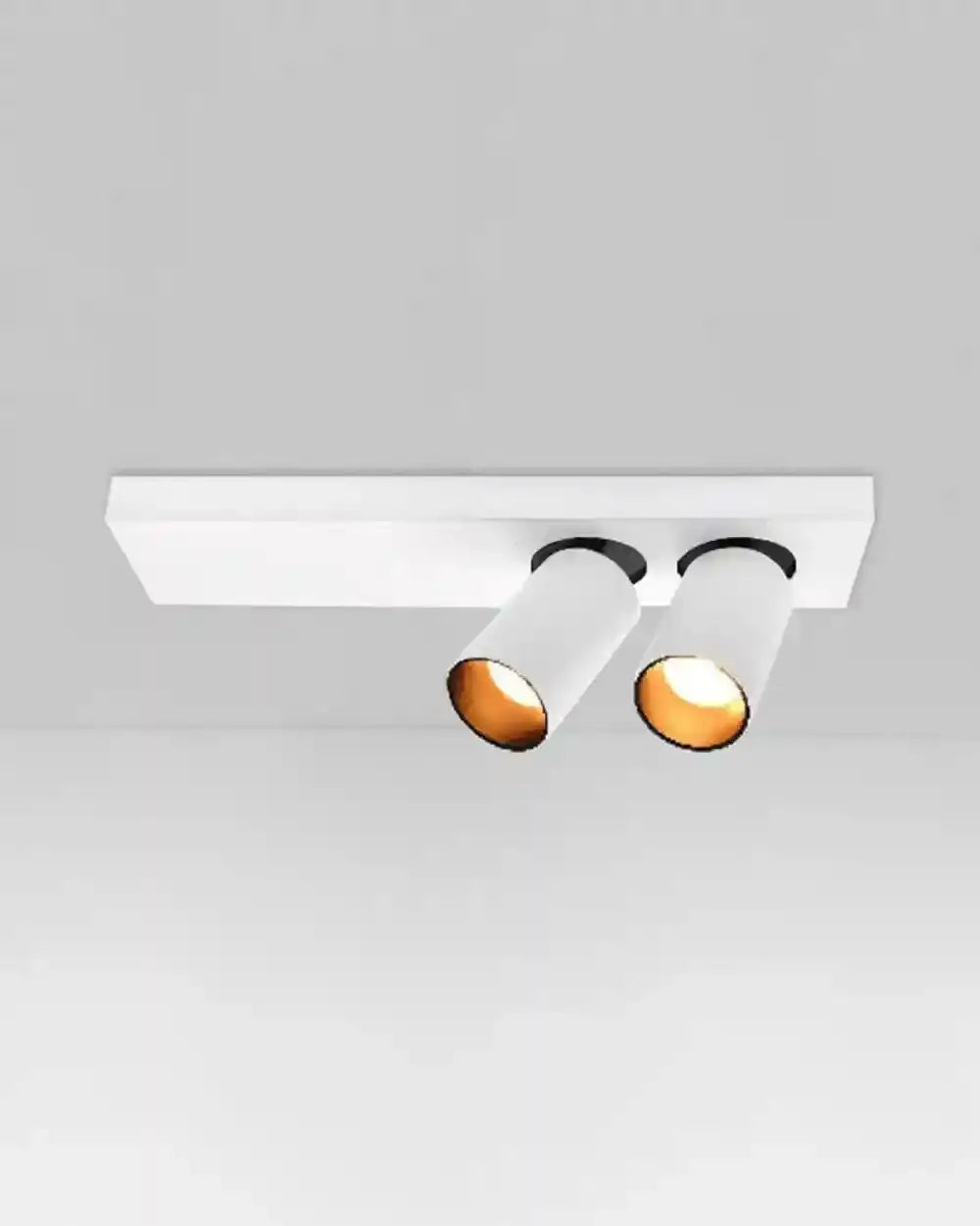 Lámpara de techo blanca con dos focos cilíndricos orientables tipo GU10, iluminación moderna.