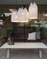 Lámparas colgantes modernas sobre banco y mesa en terraza, decoración de Birot MX boutique de iluminación