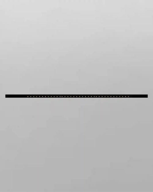 Luminaria lineal negra moderna sobre pared gris, boutique de iluminación Birot MX.