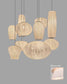 Lámparas colgantes de diseño en tonos blanco roto, estilo moderno, iluminación decorativa.