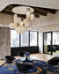Lámparas colgantes modernas en sala de estar elegante con sillones y alfombra decorativa.