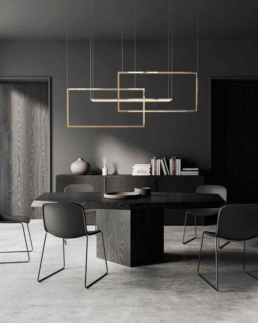 Lámpara colgante moderna sobre mesa negra en comedor minimalista, iluminación Birot MX.