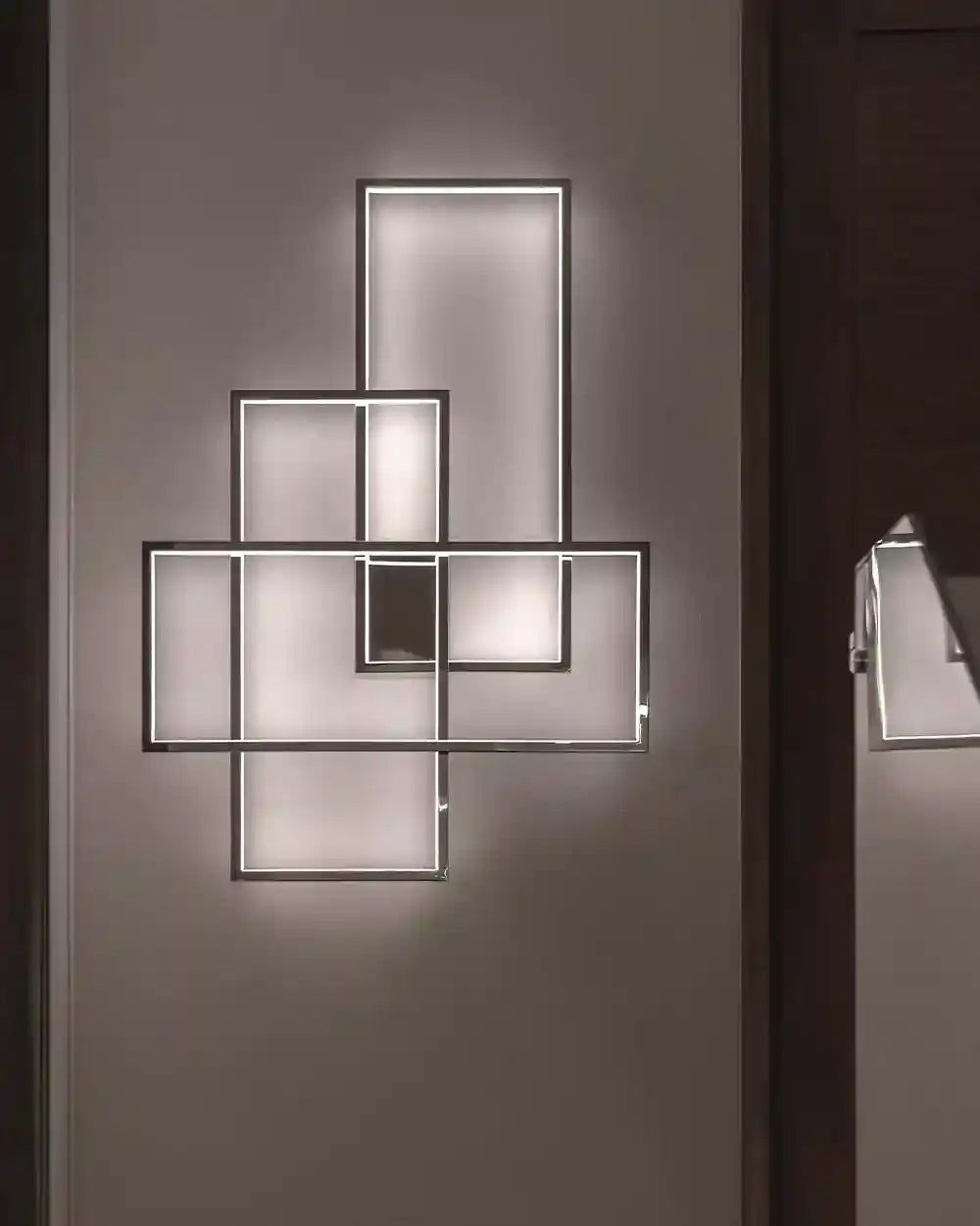Lámpara de pared geométrica moderna con luz LED en boutique de iluminación Birot MX