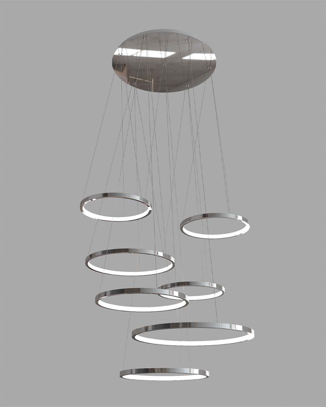 Lámpara colgante moderna de aros LED, acabado plateado, diseño minimalista, iluminación decorativa.