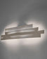 Aplique de pared moderno blanco iluminando fondo gris, diseño minimalista de iluminación Birot MX