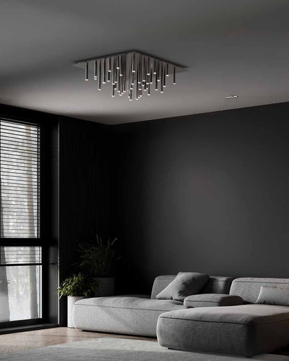 Sala moderna con sofá gris y lámpara de techo decorativa de varillas LED minimalista