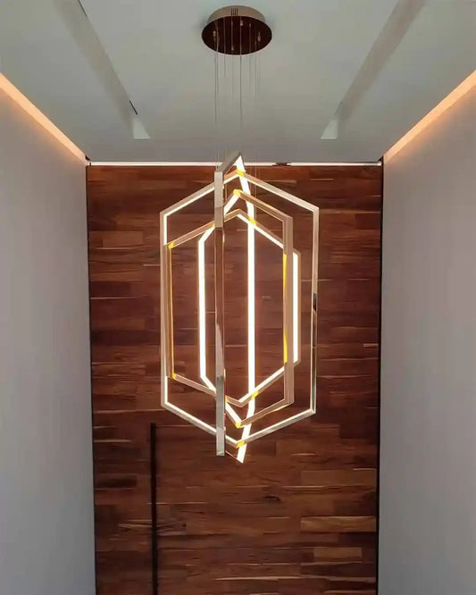 Lámpara colgante geométrica dorada en pared de madera, iluminación moderna Birot MX