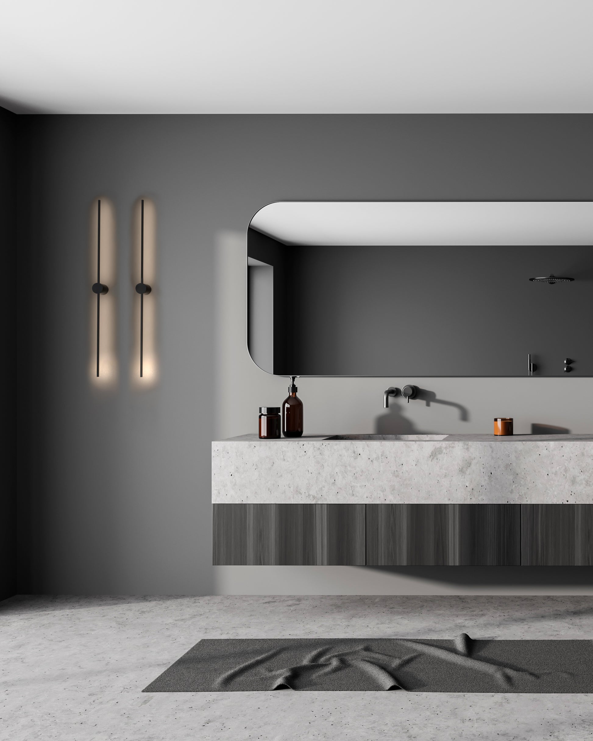 Baño moderno con iluminación decorativa de pared, lavabo flotante y espejo grande.