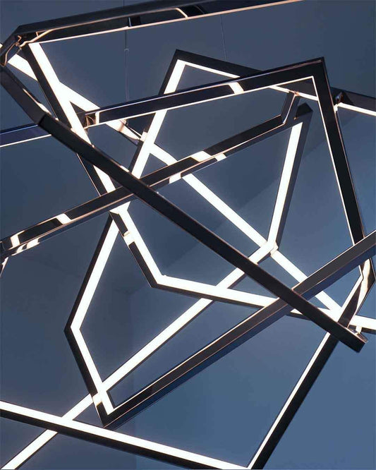 Lámpara geométrica moderna de Birot MX, estructura negra con luz LED, ambiente minimalista