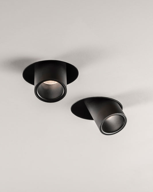 Luminarias de techo negras cilíndricas de diseño moderno para iluminación interior.