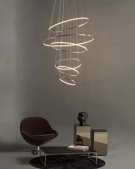 Lámpara de aros LED colgantes moderna en sala minimalista, boutique de iluminación Birot MX